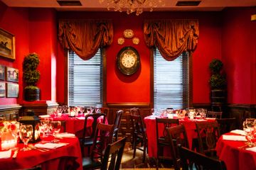 Red interior in dining room at Kings' Carriage House. British Tea Shops Upper East Side Yorkville