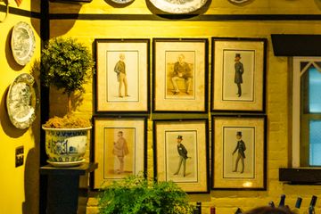 Old artwork on the wall at Kings' Carriage House. Tea Shops British Upper East Side Yorkville