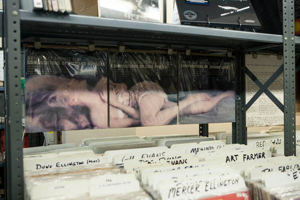 Browsing rare jazz vinyl records at Jazz Record Center in Manhattan