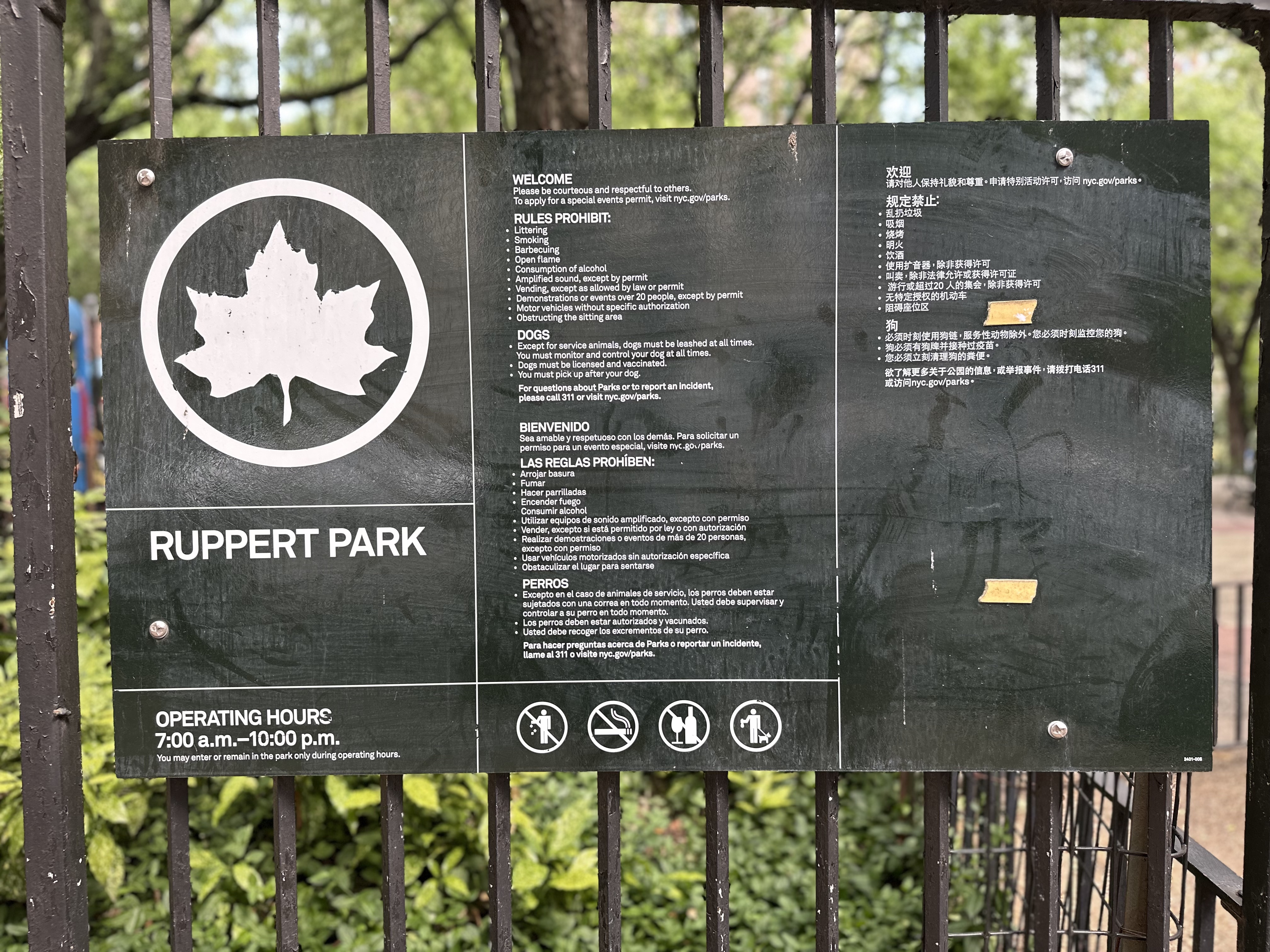 NYC Parks make use of symbols on their signs.